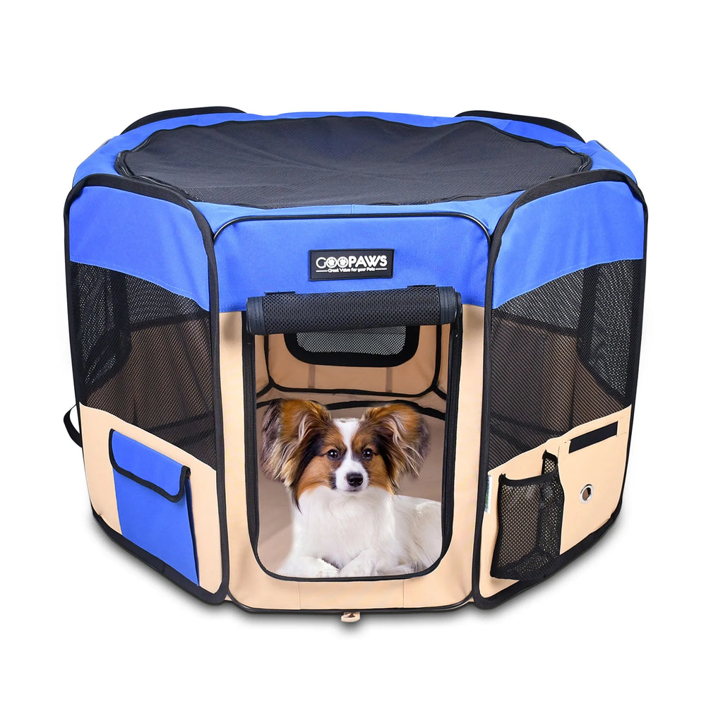 Small dog sitting in a blue and beige GOOPAWS soft portable dog playpen